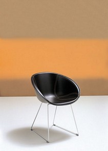 Chrome chair with technopolymer shell covered in real leather with visible stitches