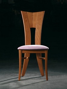 Modern wood chair upholstered in choice of fabric and wood polish