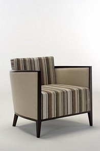 Modern lounge chair upholstered in choice of fabric and wood polish 