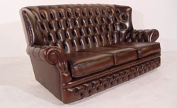 Traditional three seater sofa, chesterfield style, upholstered in real leather