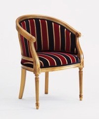 Traditional lounge chair upholstered in choice of fabric and wood polish